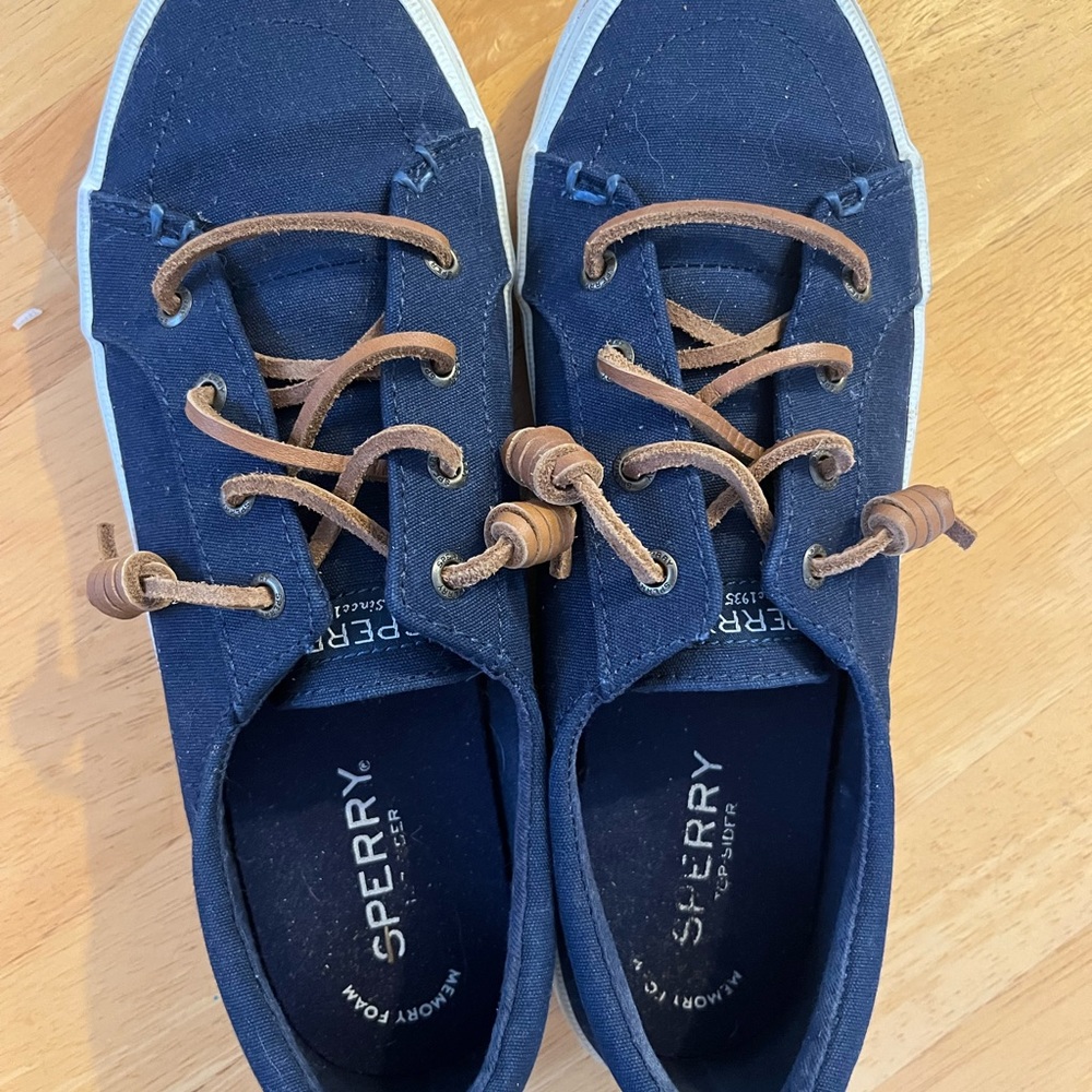 Navy blue Sperry boat shoes.